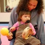 Mother and Toddler playing an Instrument