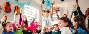 Group of toddlers enjoying music related activities.