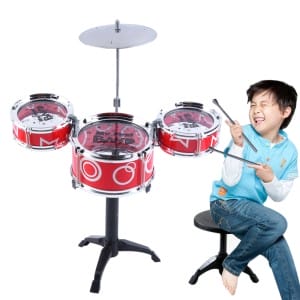 Happy kid drumming 