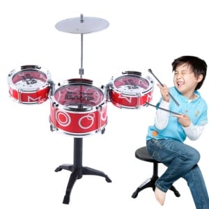 Happy kid drumming