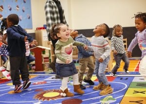 Toddlers getting the benefits of music stimulation, singing and dancing.