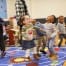 Toddlers getting the benefits of music stimulation, singing and dancing.