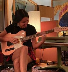 Olivia Rodrigo playing the guitar. Picture from Pinterest.