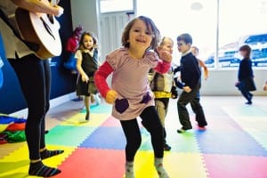 Pre-schoolers-dancing-colorful-mats-floor