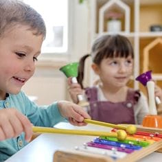 Preschoolers-playing-colorful-xylophone