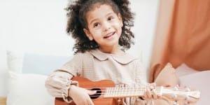 Preschooler-girl-playing-ukulele
